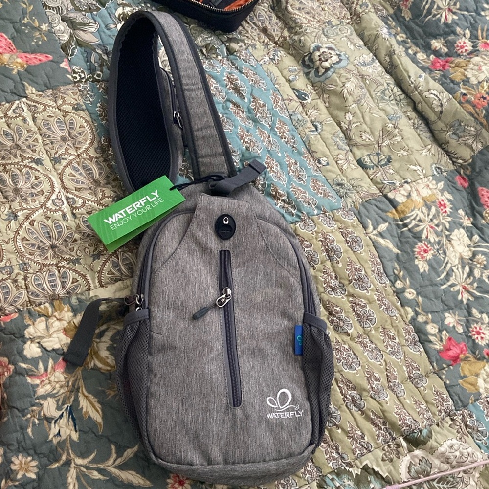 Brand new with tags Water fly anti theft sling bag